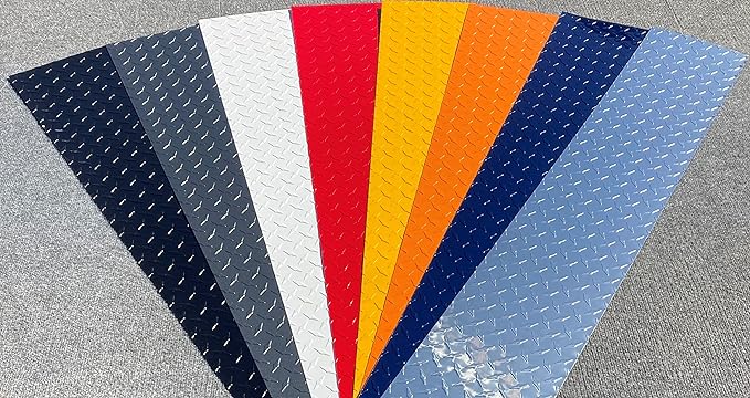 A spread of Aluminum Diamond Treadplate, all cut into rectangle strips to display the color. Each rectangle is a different color including Black, Silver, Gray, White, Red, Yellow, Orange, and Indigo Blue.