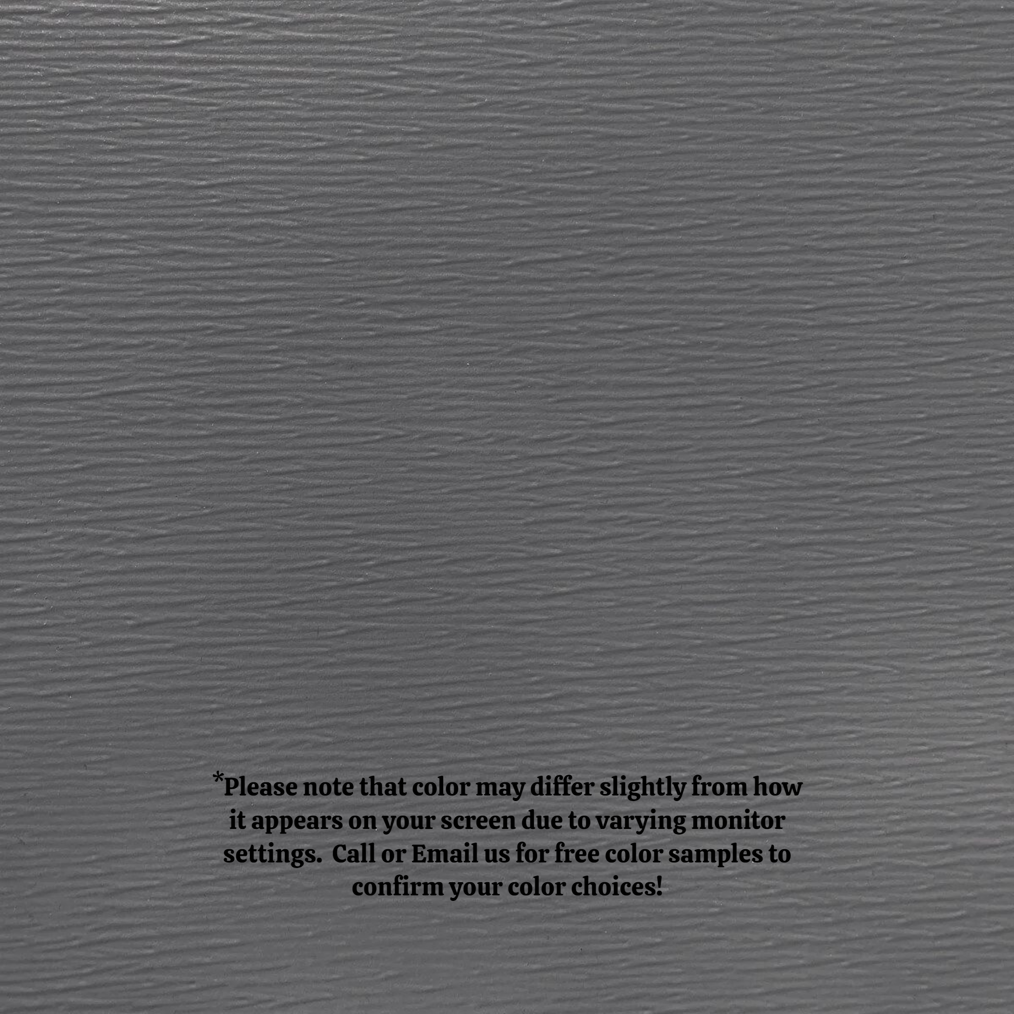 A close up of the texture of the Woodgrain Finish Aluminum Trim Coil that is Charcoal Gray in color.