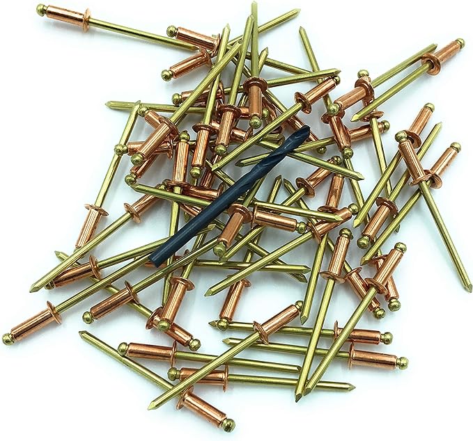 A pile of Copper Pop Rivets with a 1/8 inch drill bit laying on top.