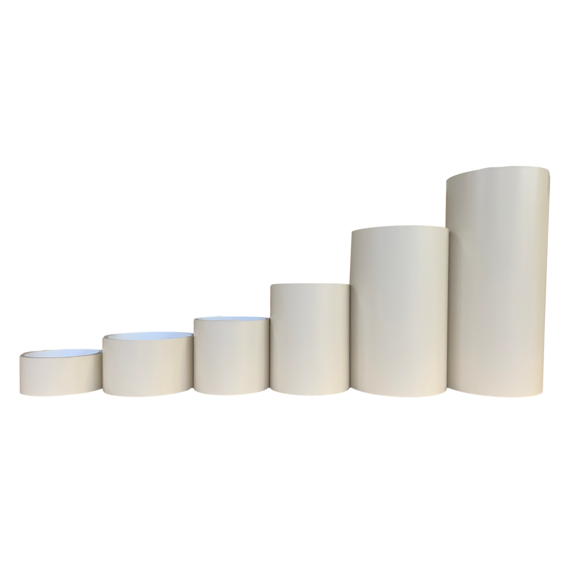 Various rolls of Smooth Aluminum Trim Coil positioned next to each other to visualize each size offered. Each roll is Cream in color.