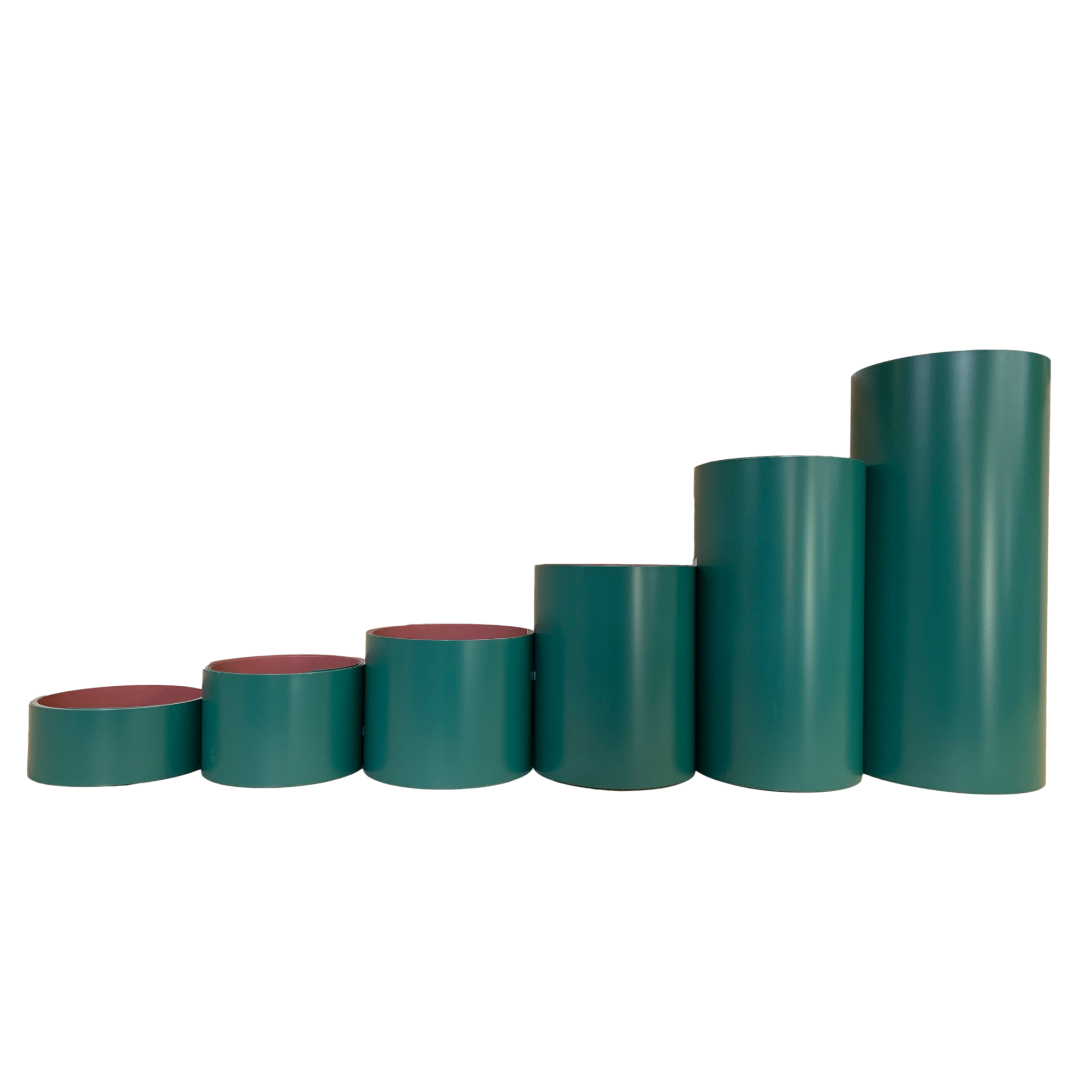 Various rolls of Smooth Aluminum Trim Coil positioned next to each other to visualize each size offered. Each roll is Grecian Green in color.