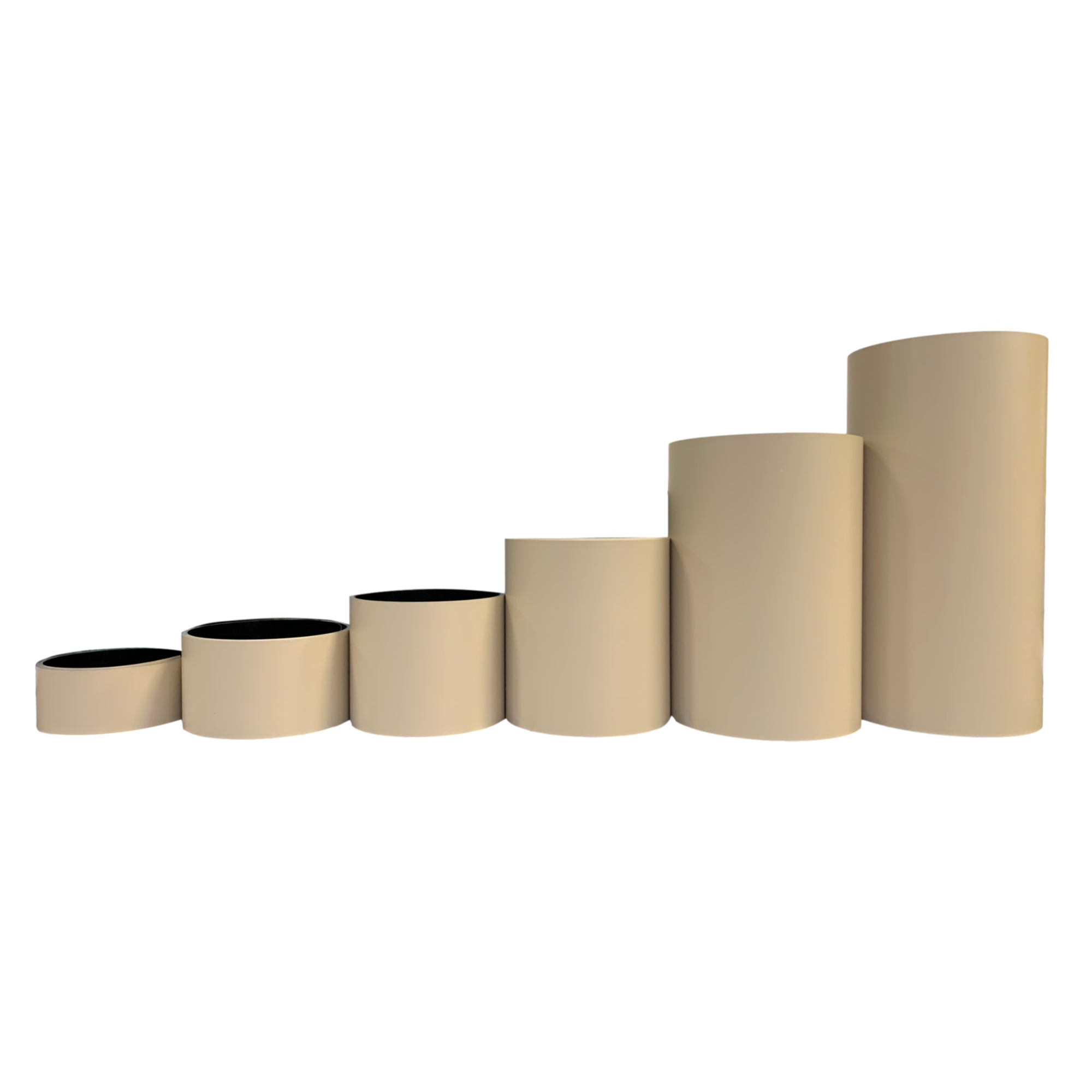 Various rolls of Smooth Aluminum Trim Coil positioned next to each other to visualize each size offered. Each roll is Ivory in color.