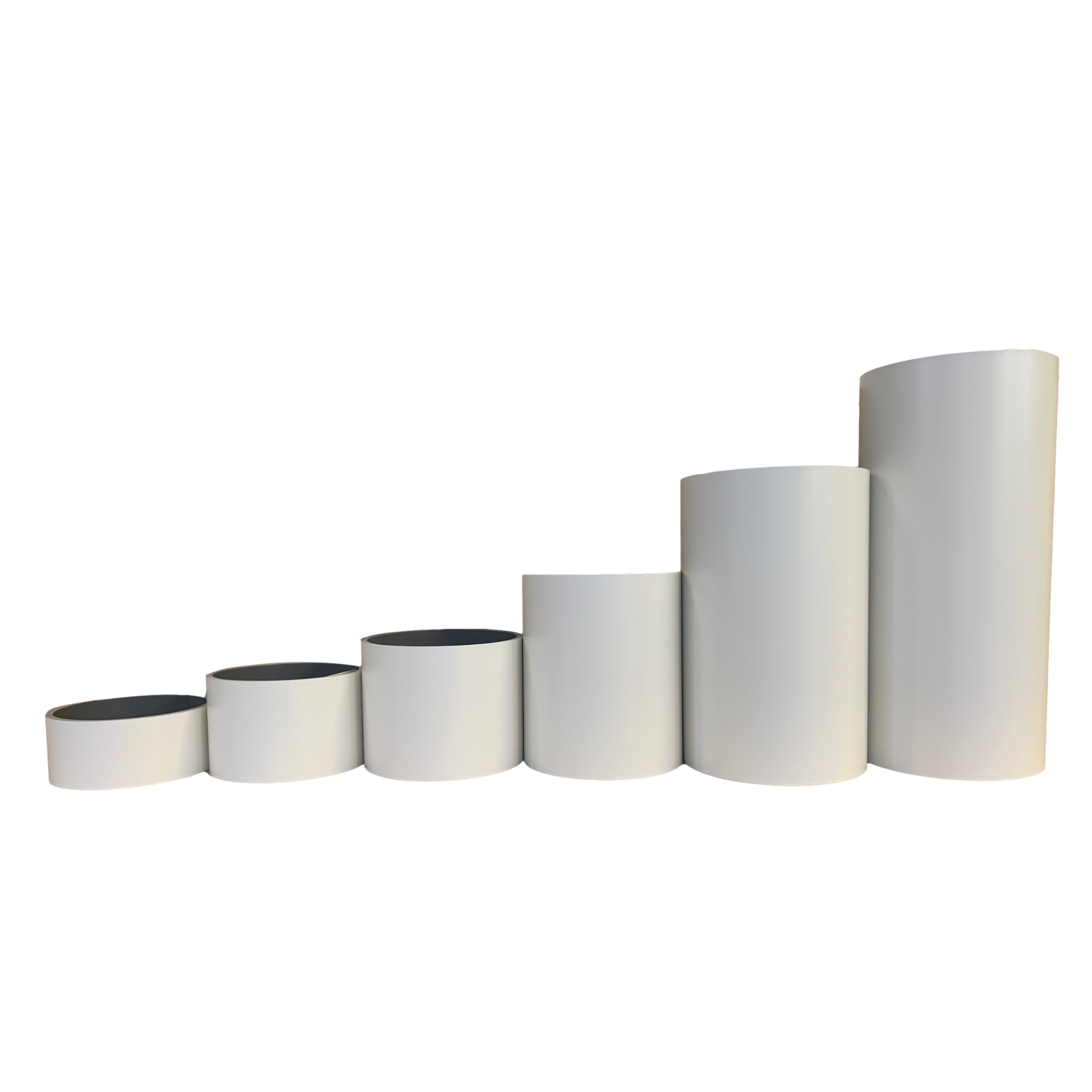 Various rolls of Smooth Aluminum Trim Coil positioned next to each other to visualize each size offered. Each roll is Linen in color.