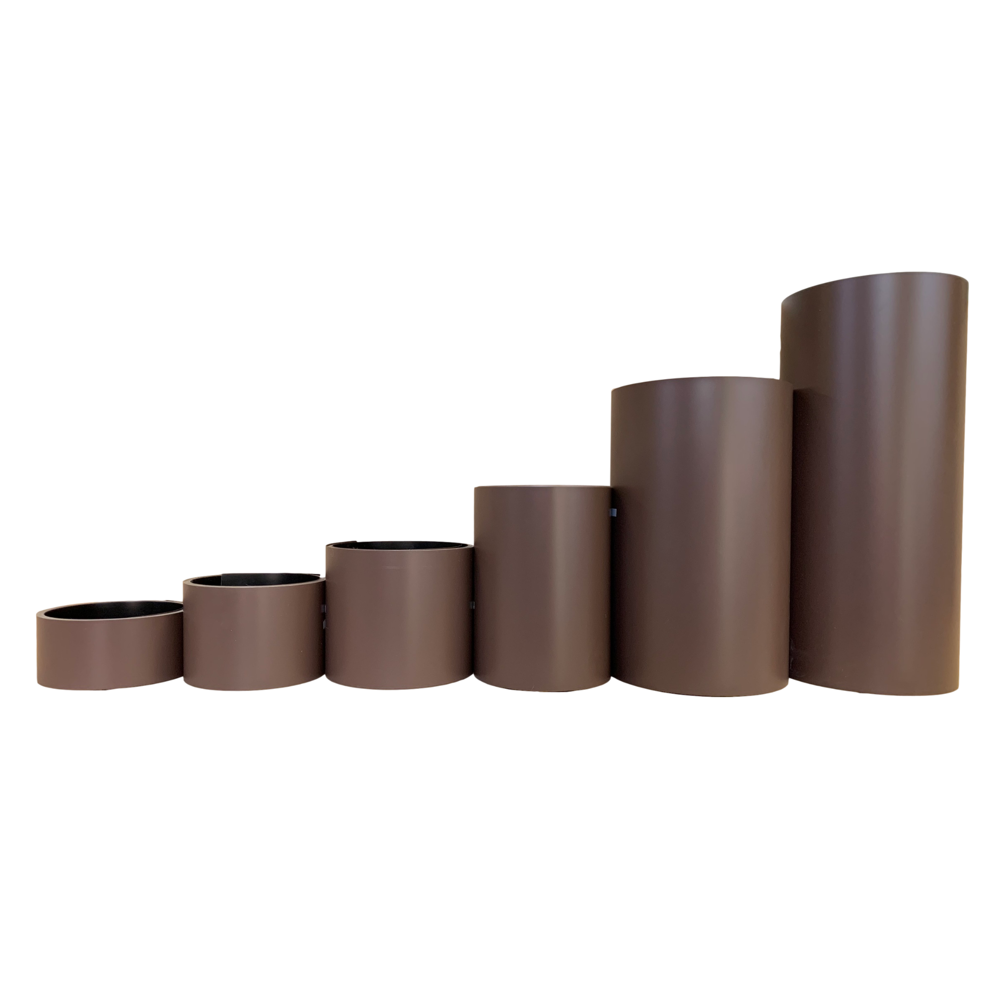Various rolls of Smooth Aluminum Trim Coil positioned next to each other to visualize each size offered. Each roll is Royal Brown in color.