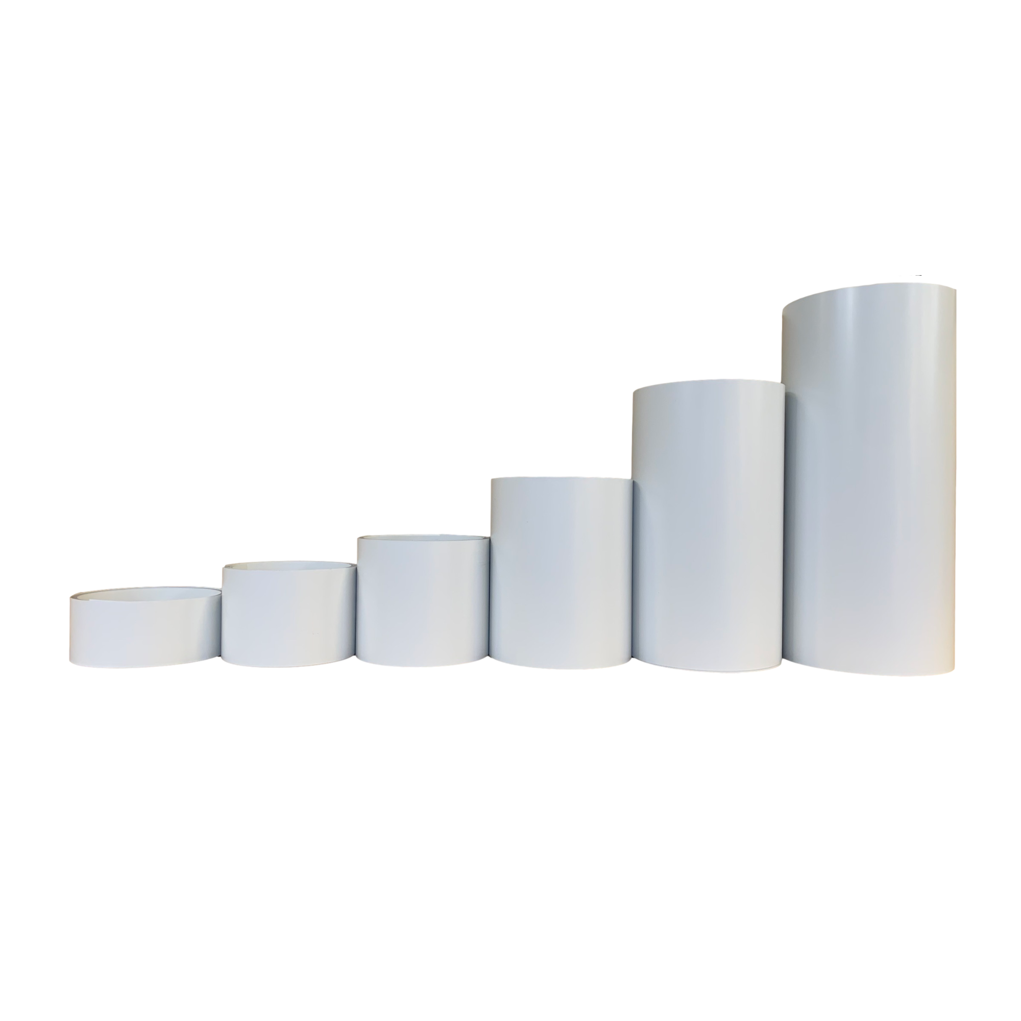 Various rolls of Smooth Aluminum Trim Coil positioned next to each other to visualize each size offered. Each roll is White in color.