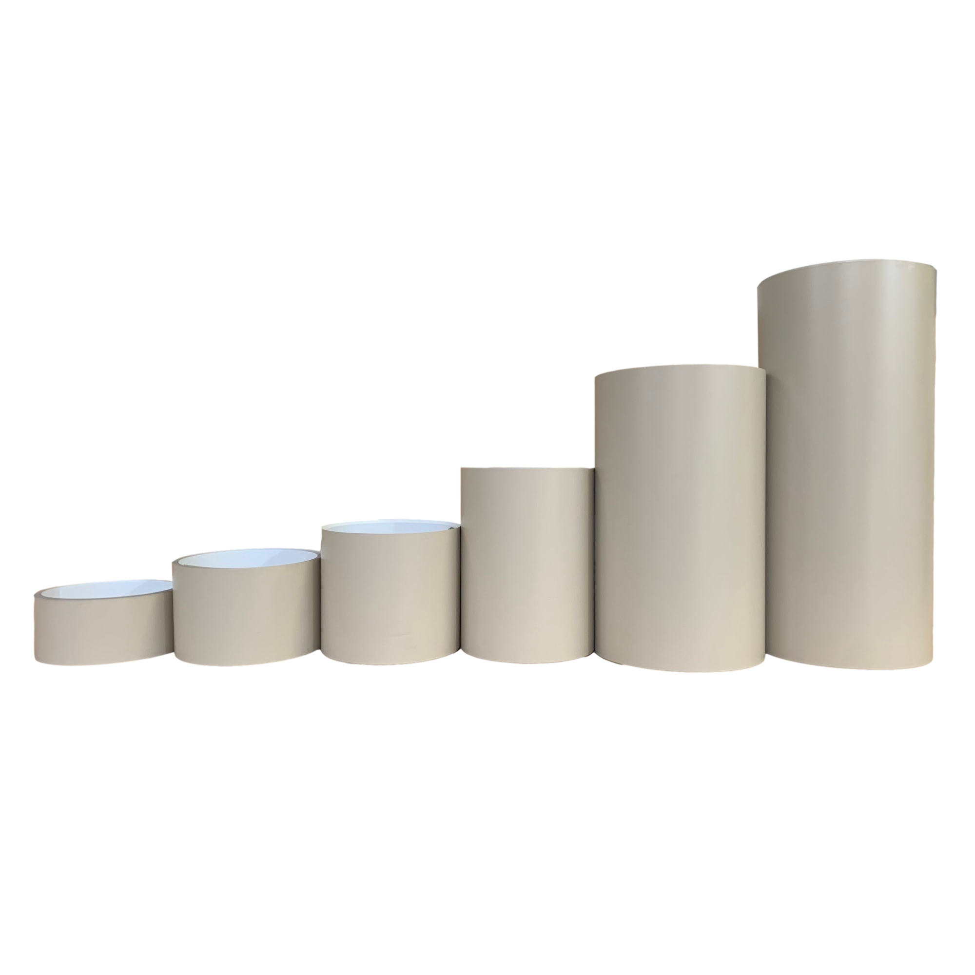 Various rolls of Smooth Aluminum Trim Coil positioned next to each other to visualize each size offered. Each roll is Wicker in color.