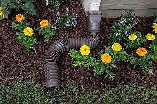 A Gutter Ground Spout Extension that is made to attach at the end of a gutter downspout extension at ground level to divert rain water from the roof to the ground. The Ground Spout is flexible for controlling water flow. 