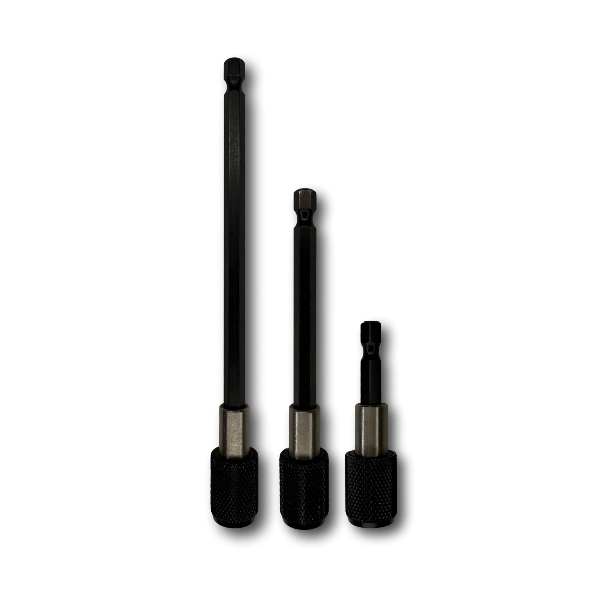 A group of quick-change driver extensions lined up next to each other. There is a 2 inch long, a 4 inch long, and a 6 inch long extension. 
